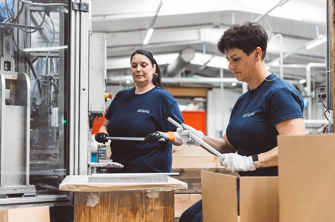 Operators preparing aluminium components for assembly