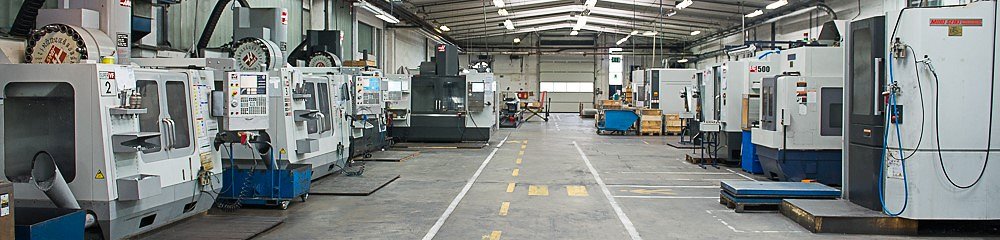 Row of CNC machining centres in the production hall