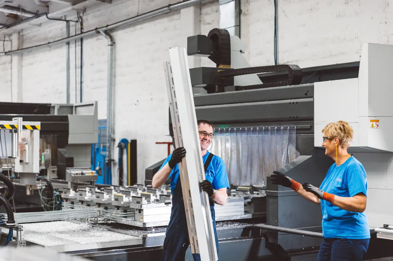 Operators preparing aluminium profiles